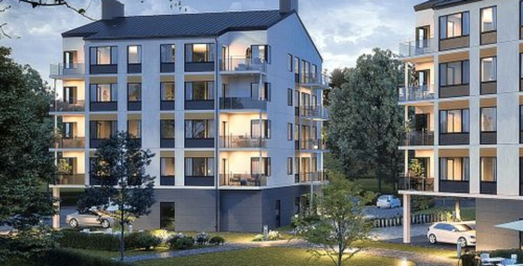 Illustration av flerbostadshus i parkmiljö med blå himmel.