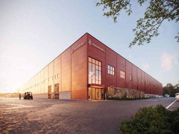 En 3D-visualisering visar en storskalig lagerbyggnad för Trafikverket med röd fasad, höga portar och markerad entré. GBJ Byggs projekt kombinerar funktionella logistikytor med en enhetlig industriarkitektur och anslutande utemiljö.
